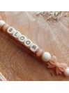 Attache sucette personnalisée en silicone, coeur paillette beige papillon noeud nude, prénom enfant.